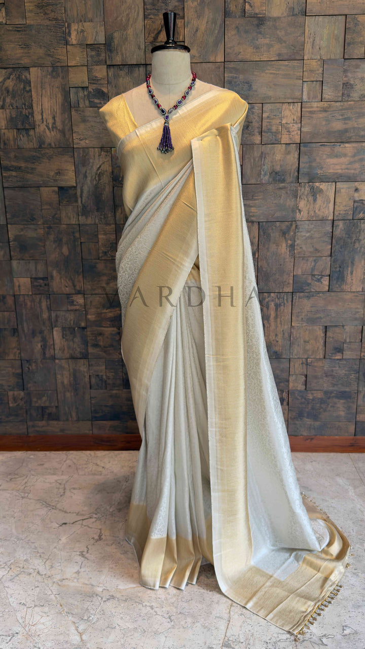 Off White Viscose Kanjivaram Tissue Silk Saree with Gold Zari Border