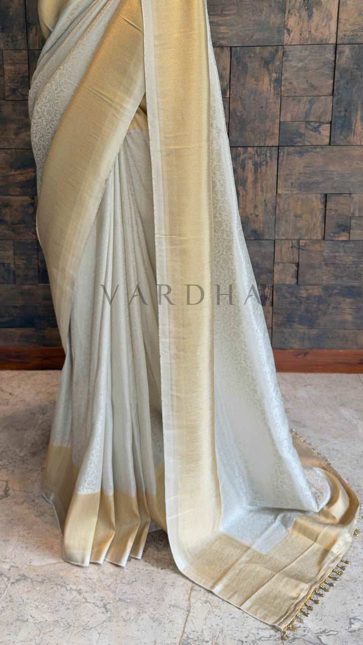 Off White Viscose Kanjivaram Tissue Silk Saree with Gold Zari Border