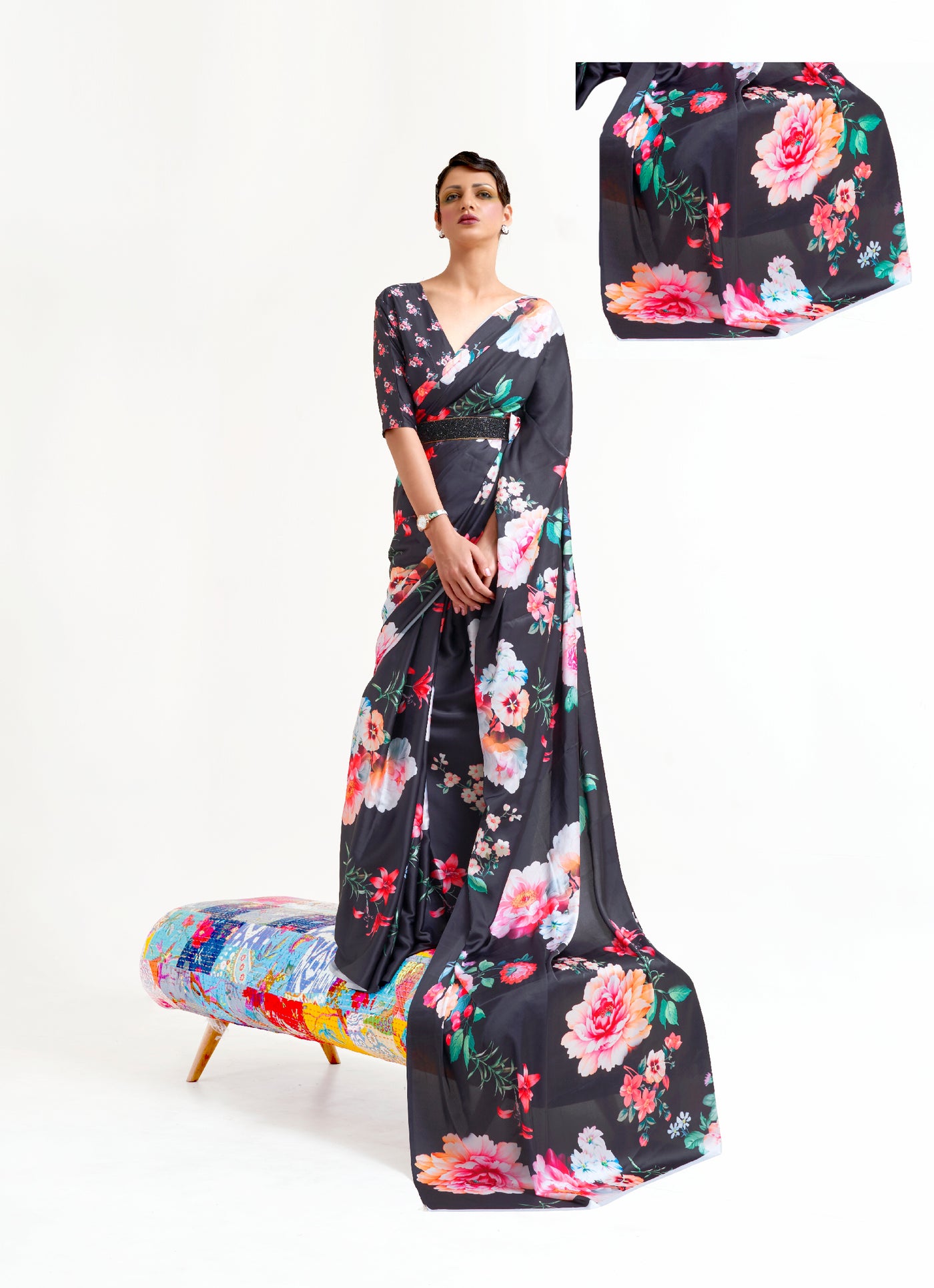 Stylish black, white, and pink crepe saree showcasing digital floral patterns and Bollywood-inspired drape, ideal for traditional functions.
