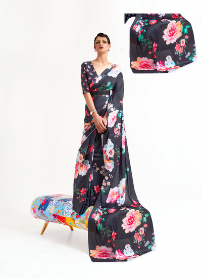 Stylish black, white, and pink crepe saree showcasing digital floral patterns and Bollywood-inspired drape, ideal for traditional functions.