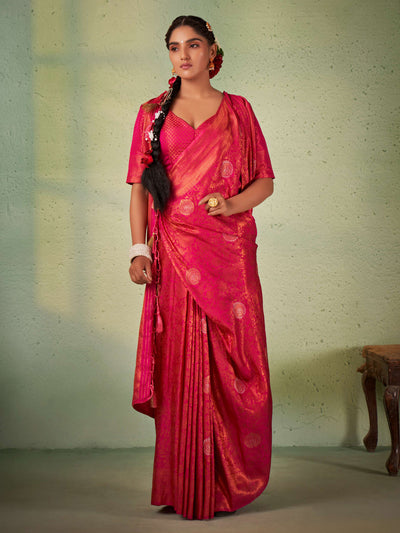 Barbie pink Kanjeevaram saree with shimmering copper zari draped elegantly.