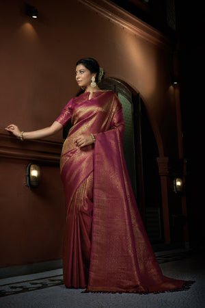 Model wearing Barbie Pink Kanjeevaram Silk Saree with golden zari work, full front view with soft pleats and matching pallu.