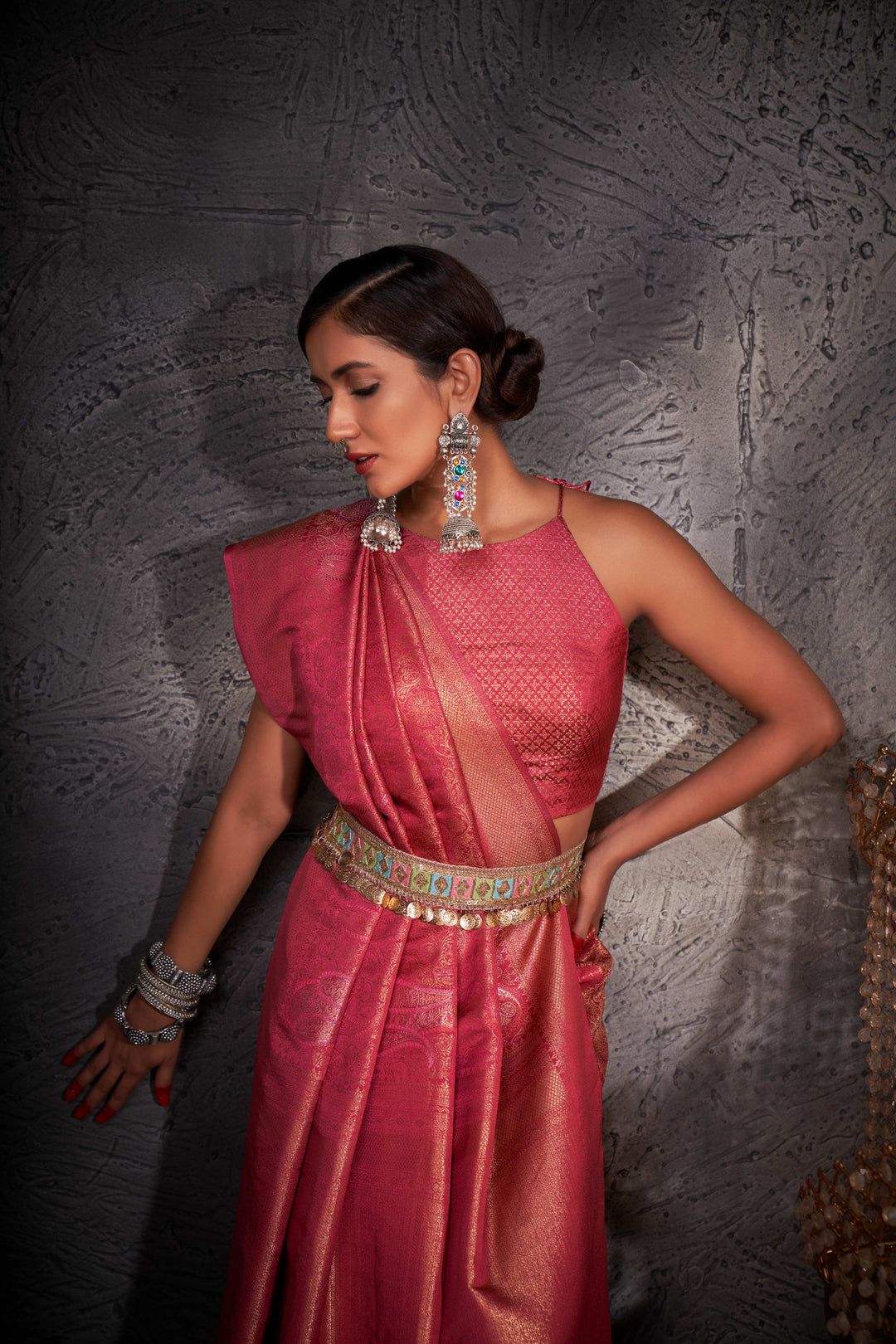 Close-up of pallu with intricate zari weaving and shimmering accents.