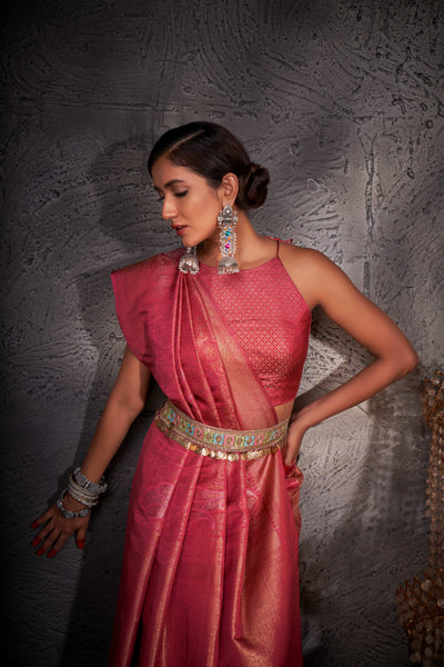 Close-up of pallu with intricate zari weaving and shimmering accents.