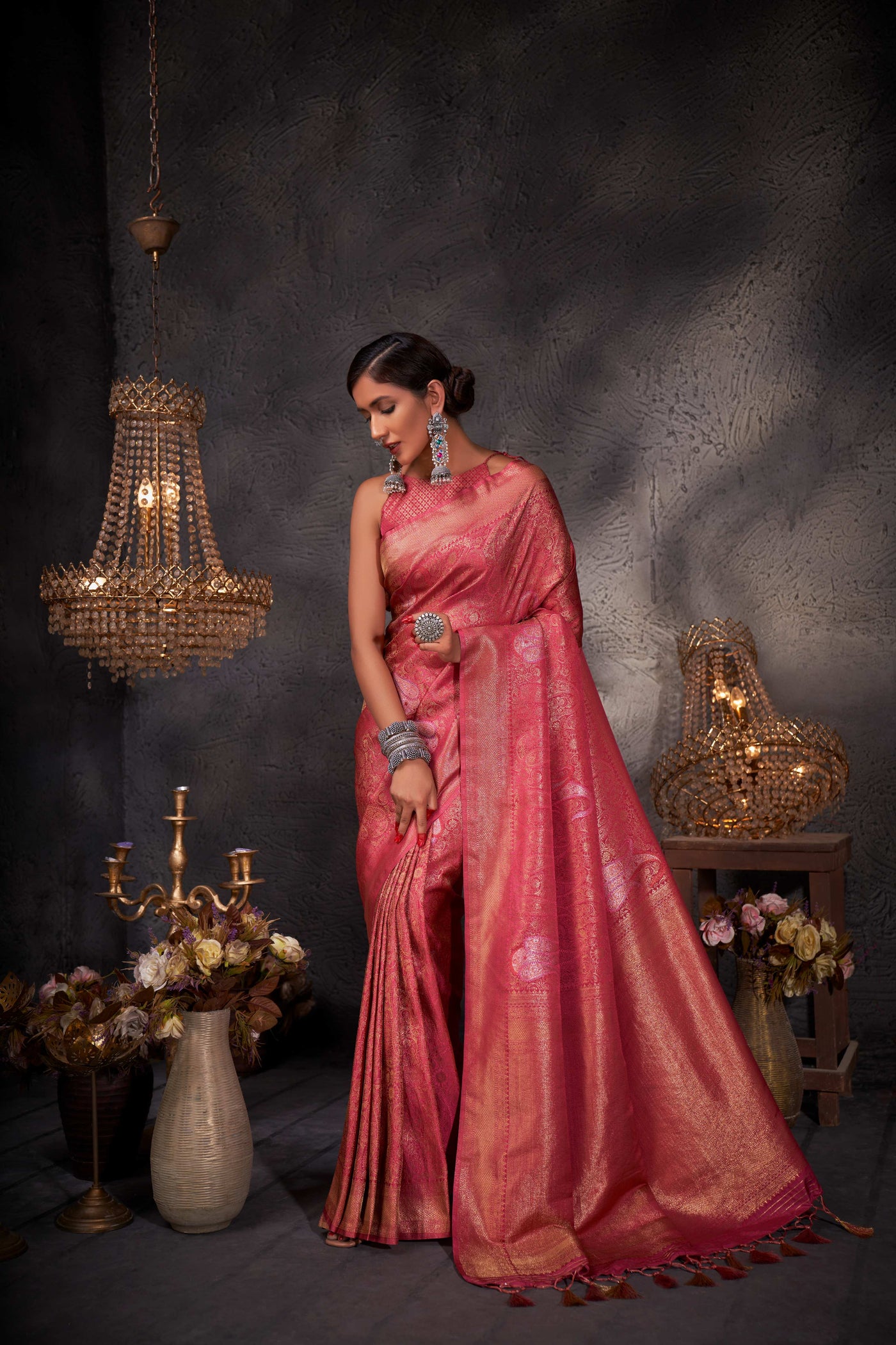 Rear view emphasizing the pallu and detailed weaving in natural lighting.