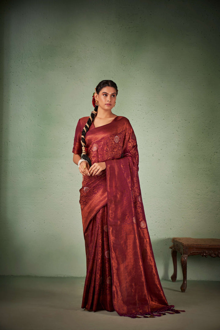 Flat-lay of saree with blouse piece, border, and pallu detail.