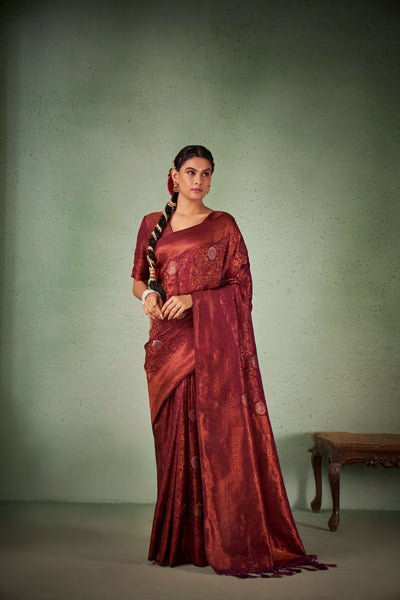 Flat-lay of saree with blouse piece, border, and pallu detail.