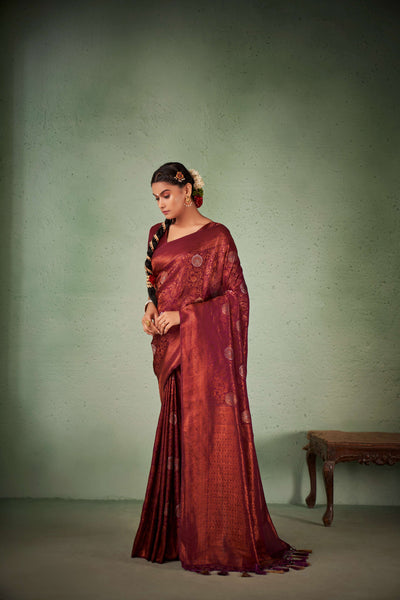 Back-drape view showcasing rich maroon pallu with copper zari.