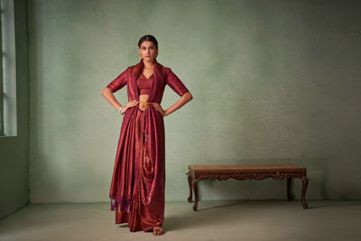 Luxurious handwoven silk blend saree with maroon tones.
