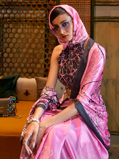 Elegant carnation pink and licorice Bollywood-style crepe saree adorned with stylish digital prints, suitable for festive celebrations.