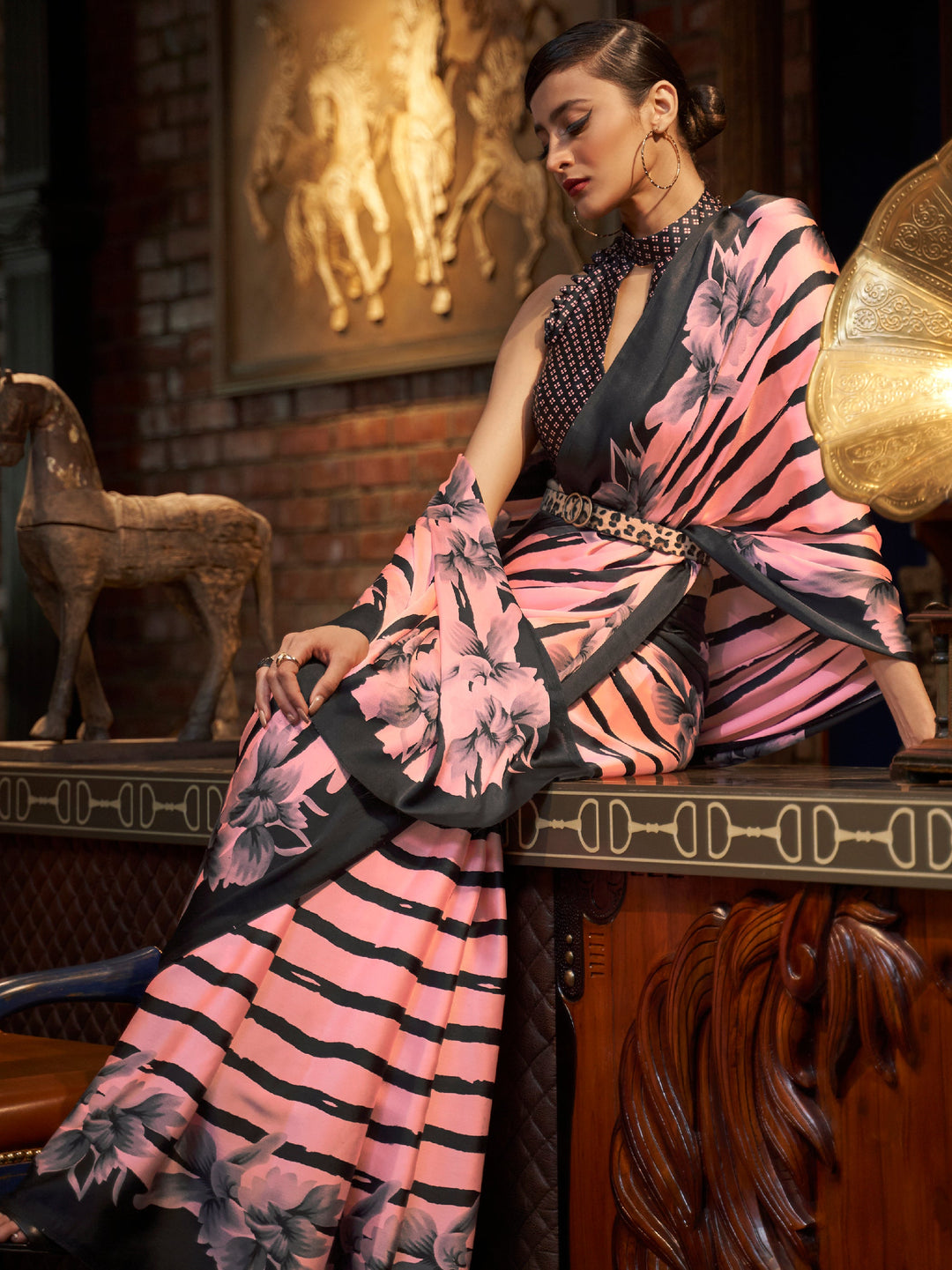 Elegant cherry pink and ebony Bollywood-style crepe saree adorned with digital prints, suitable for festive celebrations.