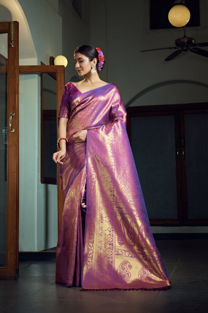 Side angle showcasing the golden zari border and pallu detailing.