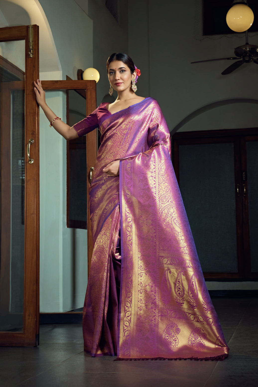Flat lay displaying the saree texture, blouse piece, and woven motif designs.