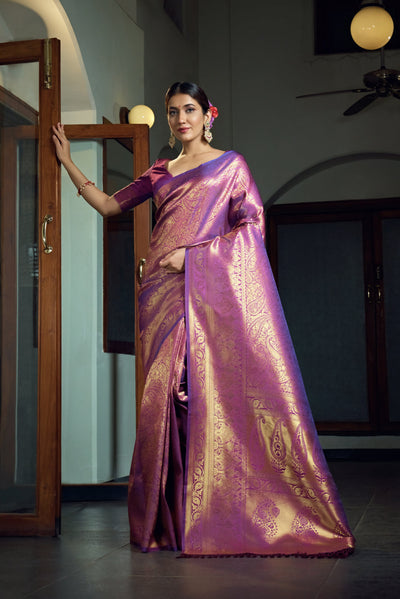 Flat lay displaying the saree texture, blouse piece, and woven motif designs.