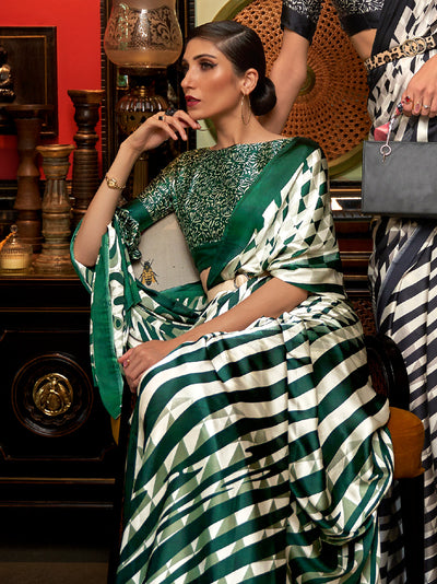 Elegant ivory and Brunswick green Bollywood-style crepe saree adorned with stylish digital prints, suitable for festive celebrations.