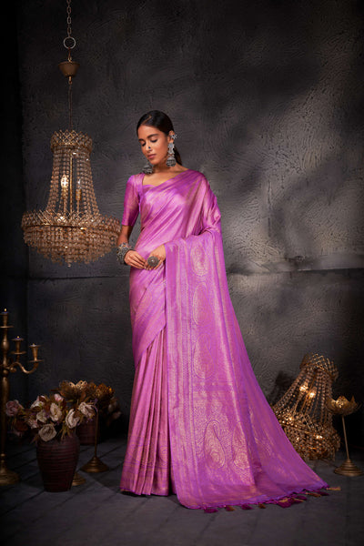 Full-length image focusing on the saree's elegant flow and shimmering zari detail.