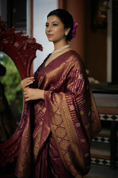 Close-up of floral butta motifs and dual-tone zari detailing on the body.