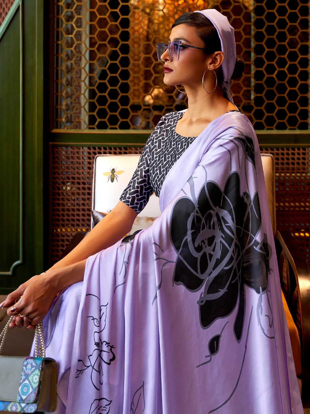 Elegant pale purple and charcoal Bollywood-style crepe saree adorned with stylish digital prints, suitable for festive celebrations.