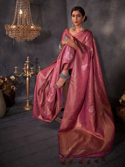 Model draped in raspberry pink Kanjeevaram silk saree with gold, copper, and silver zari motifs.