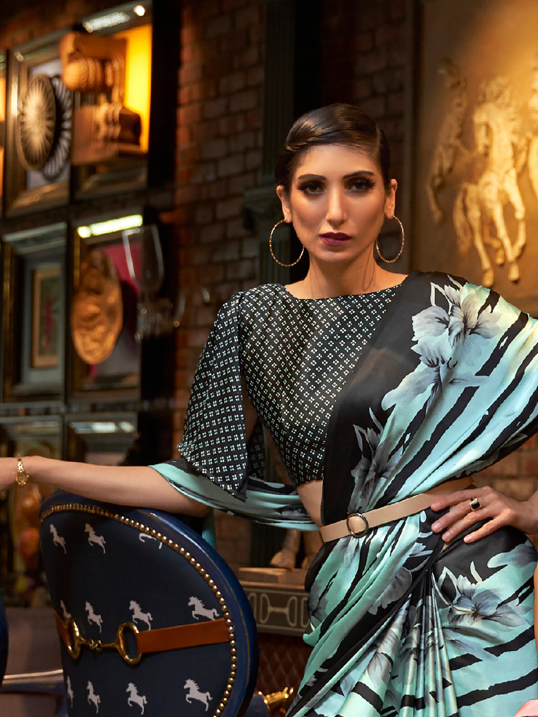 Elegant robin egg blue and ebony Bollywood-style crepe saree adorned with stylish digital prints, suitable for festive celebrations.