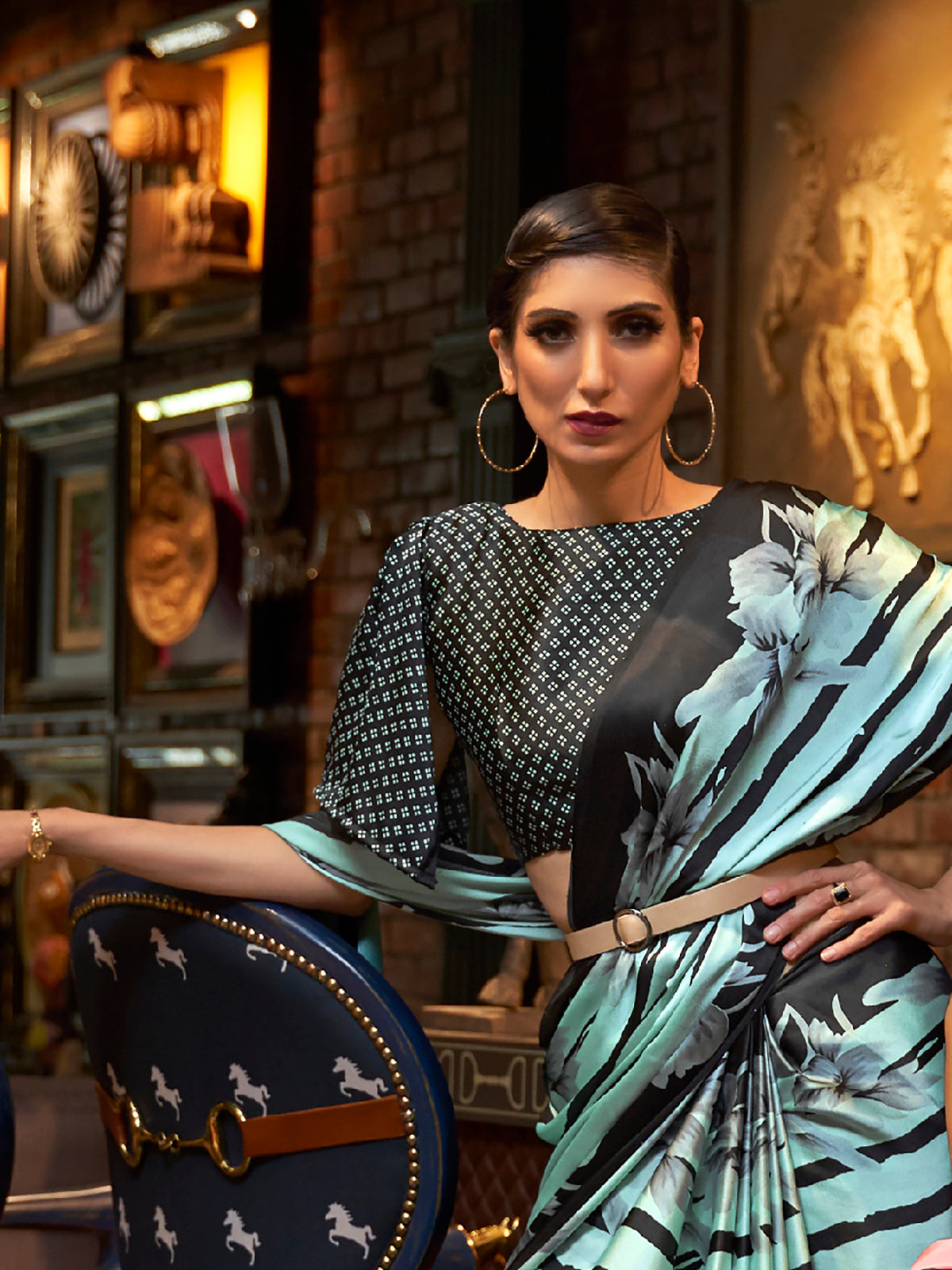 Elegant robin egg blue and ebony Bollywood-style crepe saree adorned with stylish digital prints, suitable for festive celebrations.