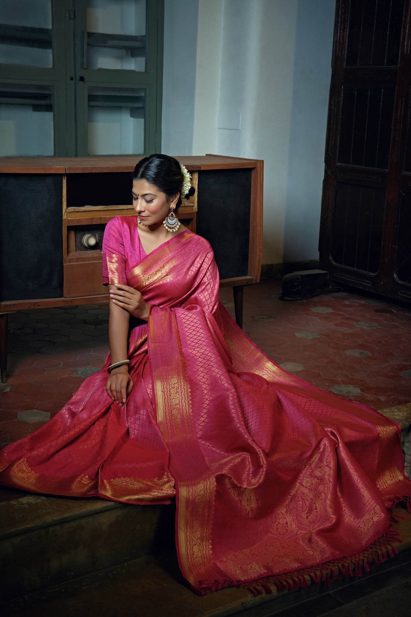 Blouse fabric placed beside the saree for styling reference.