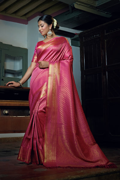 Close-up view of mango-shaped zari motifs on the pallu and border.