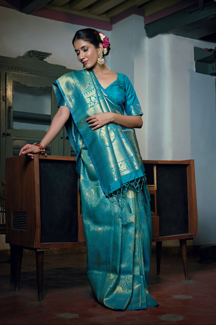 Flat lay of the saree showing the silk texture and matching blouse piece.