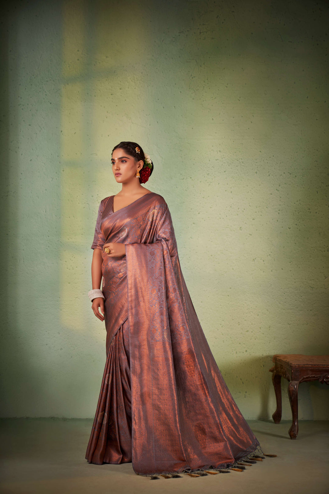 Side profile showing fluid silk texture and zari richness.