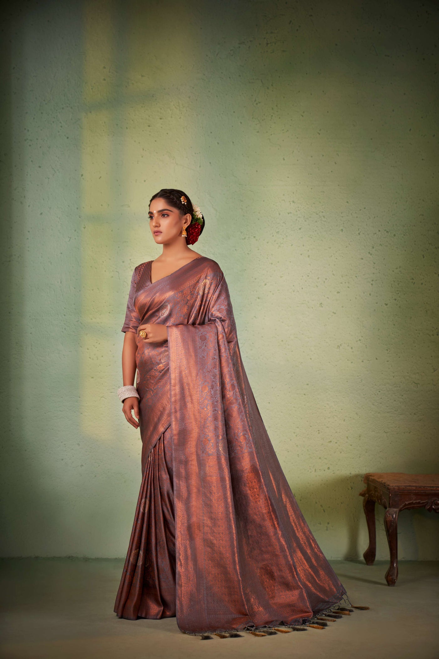 Side profile showing fluid silk texture and zari richness.