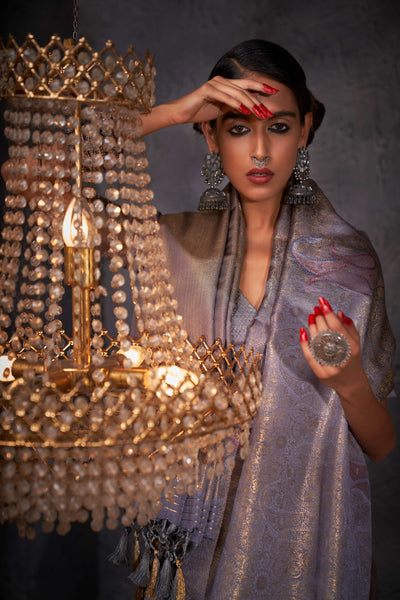 Close-up of multi-metallic zari work showcasing the fine craftsmanship and texture on grey silk.