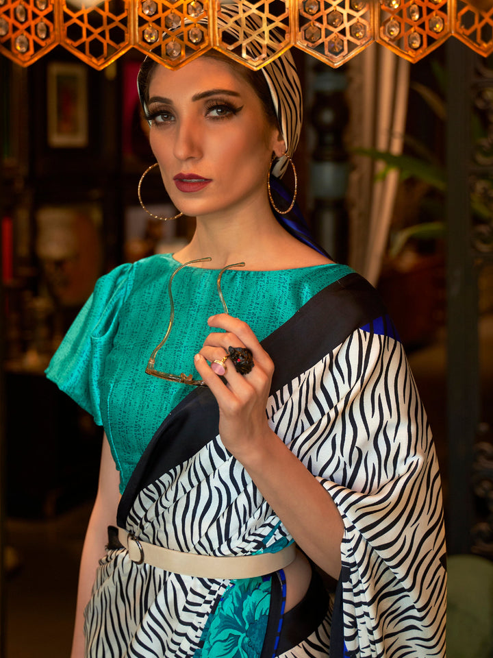 Stunning tri-tone Bollywood crepe saree with Snow White, Royal Blue, and Ebony hues, featuring intricate digital prints and a luxe festive vibe.