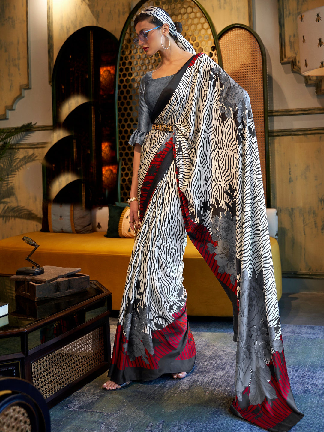 Elegant snow white, smoky black, and blood red Bollywood crepe saree with striking digital prints, designed for a luxurious festive look.