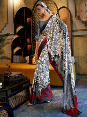 Elegant snow white, smoky black, and blood red Bollywood crepe saree with striking digital prints, designed for a luxurious festive look.