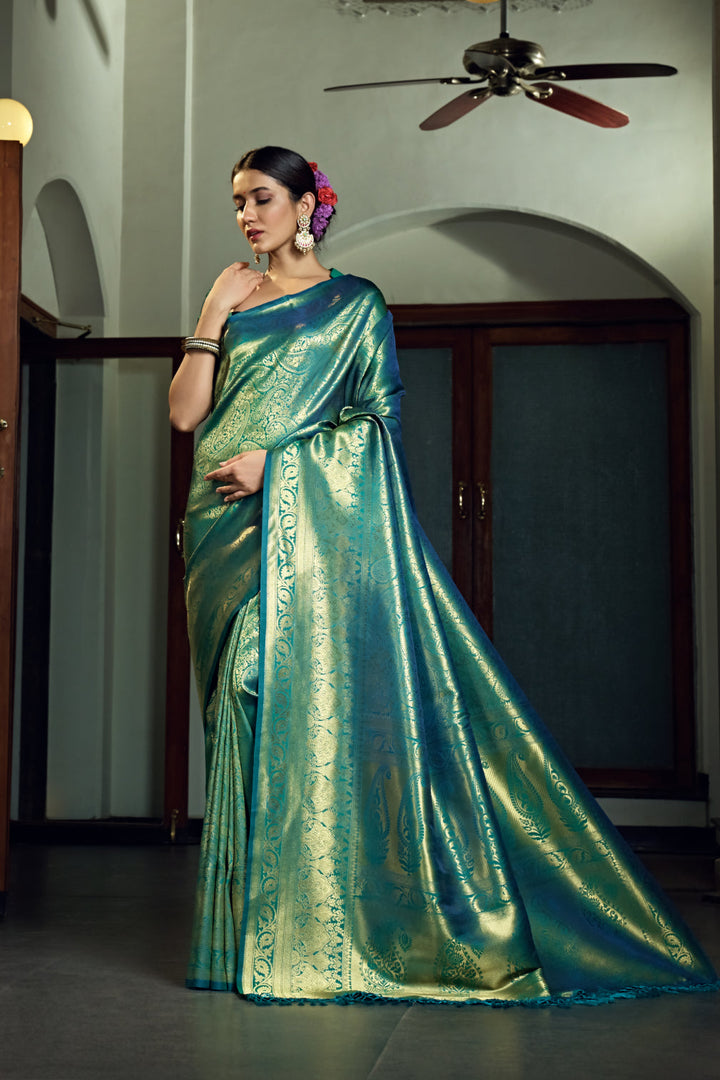 Side profile image of model showing pleats and zari border detail.