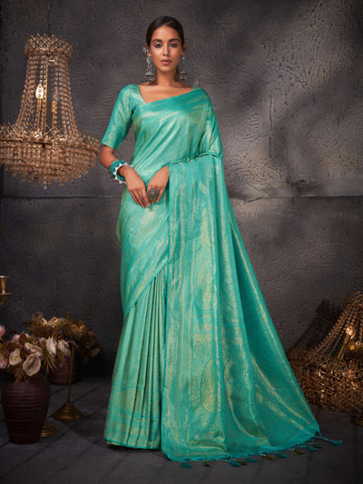Full-length shot highlighting the graceful drape and rich, lustrous texture of the saree.