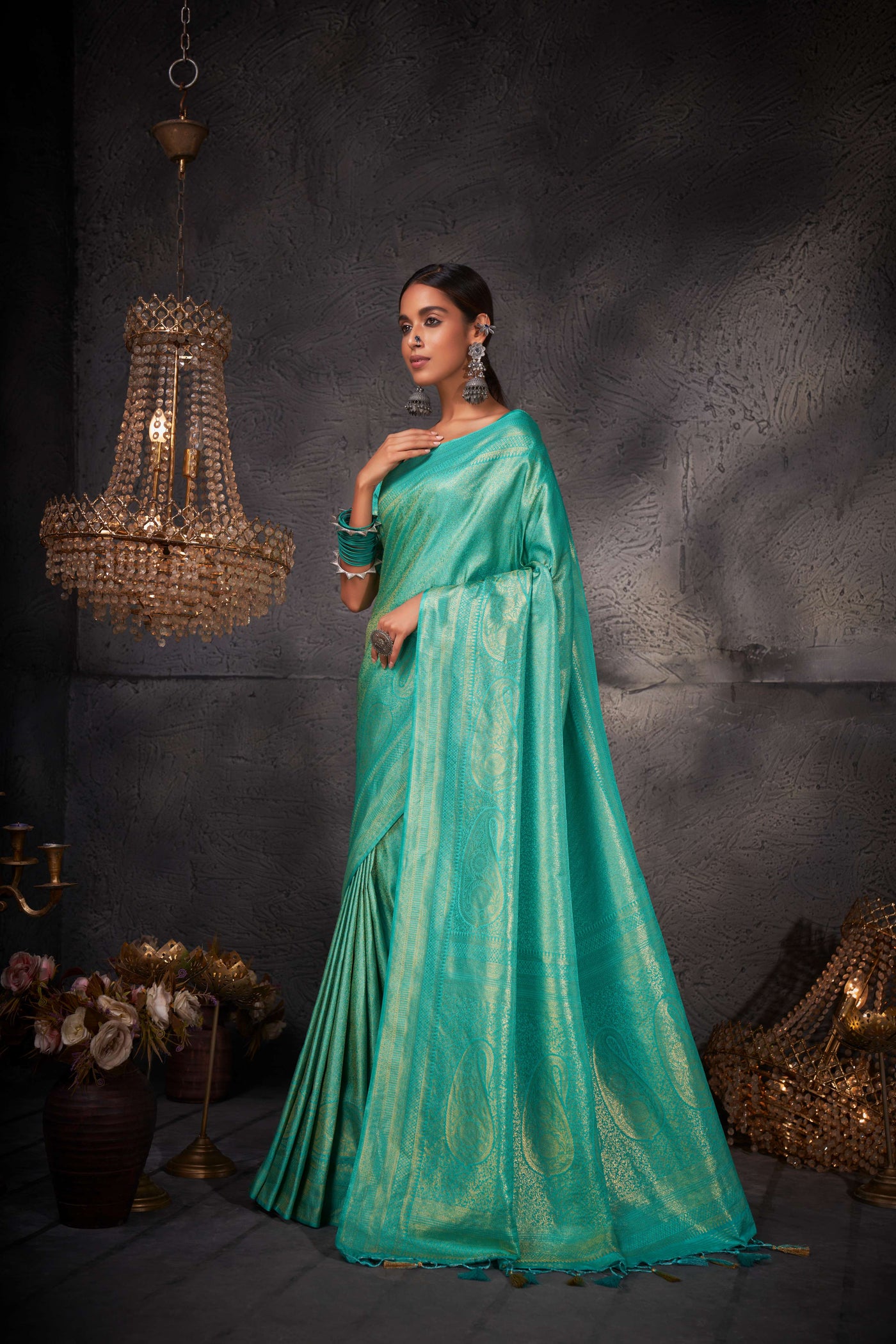 Elegant saree displayed in full length, emphasizing its smooth texture and rich fabric.
