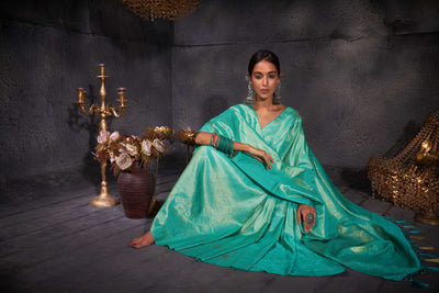 Complete view of the saree capturing its graceful silhouette and radiant sheen.