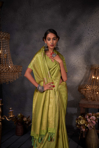 Flat lay of saree and blouse piece highlighting cohesive color and luxe texture.