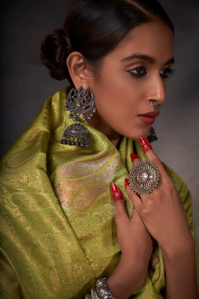 Close-up of zari motifs showcasing traditional craftsmanship and multitone metallic threads.